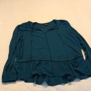 Teal shirt with ruffle around the bottom